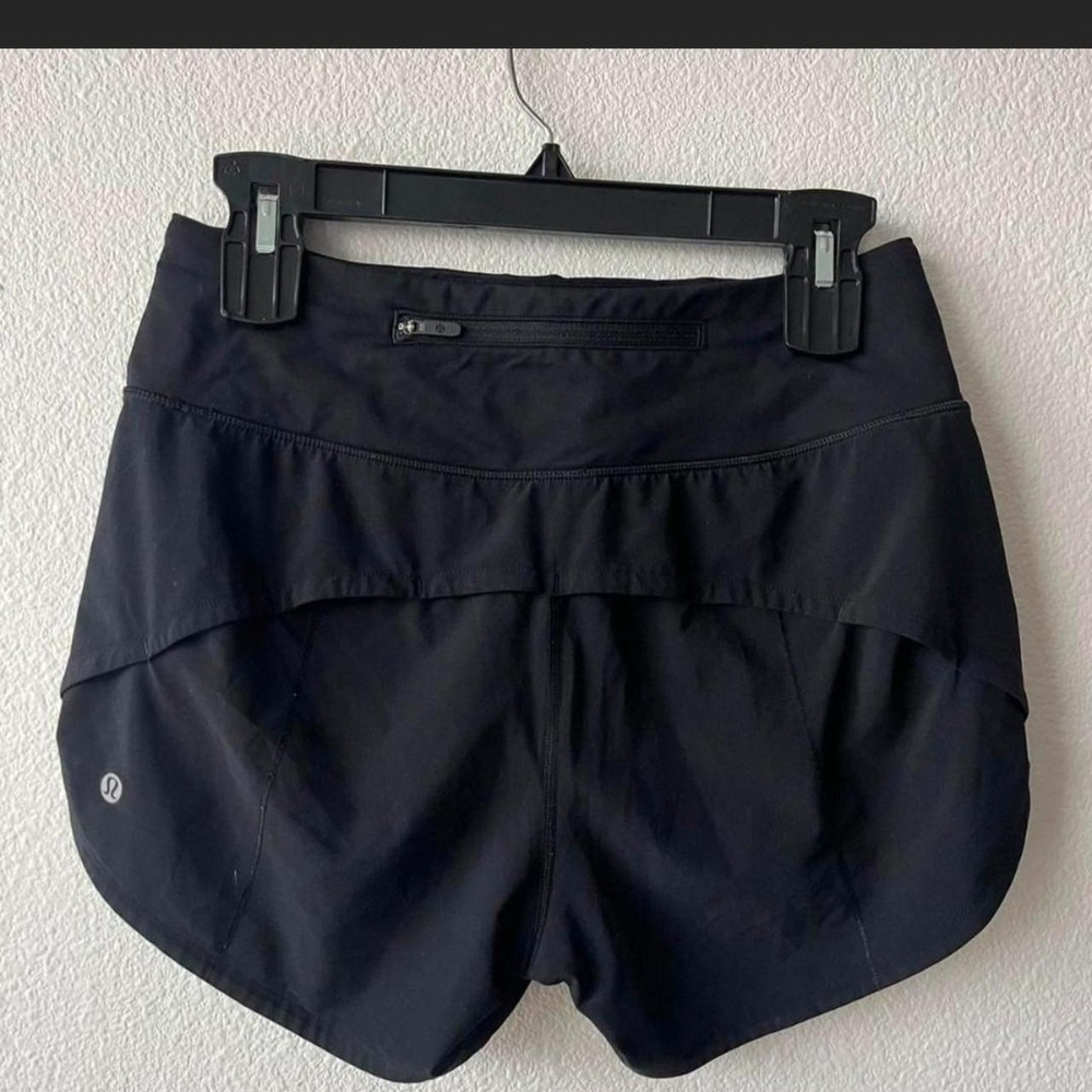 Black Mid Rise 4" Lululemon Speed Up Shorts. The liner was cut out of them.